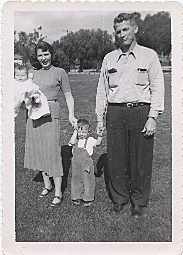 1951 picture of me with mom, dad and John - mother wrote on back of photo - "I can remember trying to hold John still so his picture could be taken.  What a live wire - already had his pocket torn.  You look just like my baby pictures.  So cute - oh, how fast time flies!"  (written on this duplicate and sent to me March, 26, 1976)