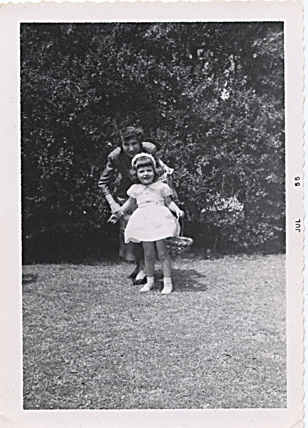 1955 Easter - I was 3 - mother wrote on back of photo - "Looking for eggs at Grandma's house - Grandma made those darling head bands of flowers for you girls herself" -- 