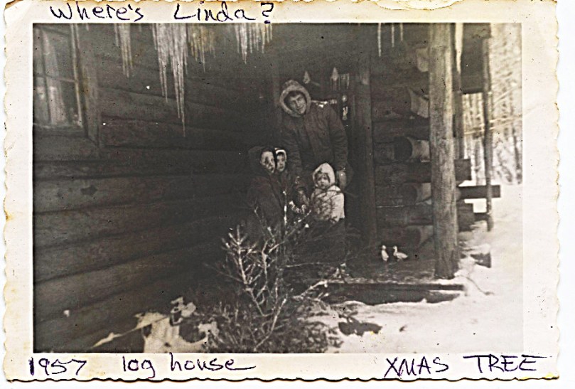 Age 6 - Mother's magic -- Linda has completely vanished from the family picture of bringing in the Christmas tree