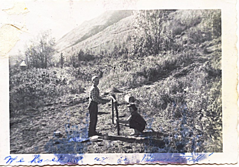 1959 John and Cindy playing on homestead - oh what a waste that we did not just STAY there!