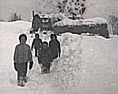 1959 December, first winter on the mountain, I'm in 3rd grade, Jamesway with gray trailer parked beside it