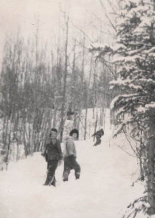 Cindy and I 1960 on the mountain walk home -- in 50 years, in 2009, those trees have grown, the land is gone to our family, subdivided, with a paved road