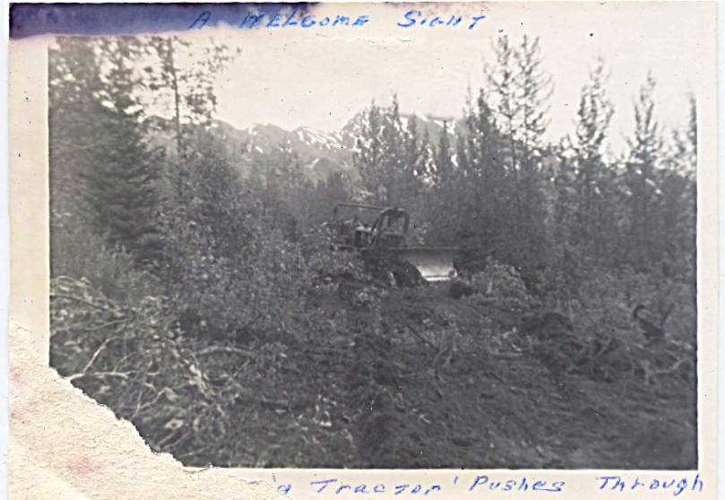 "A welcome sight" - picture is damaged, at bottom "...tractor pushes through"