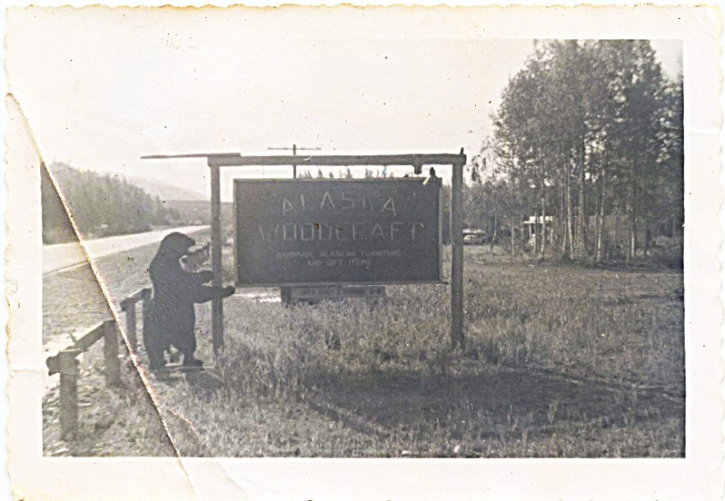 Mother writes in her early 1958 letters about working at Bockstahler's Alaskan Woodcraft Shop.  This is a picture of their sign along the old highway from Anchorage looking toward the river.